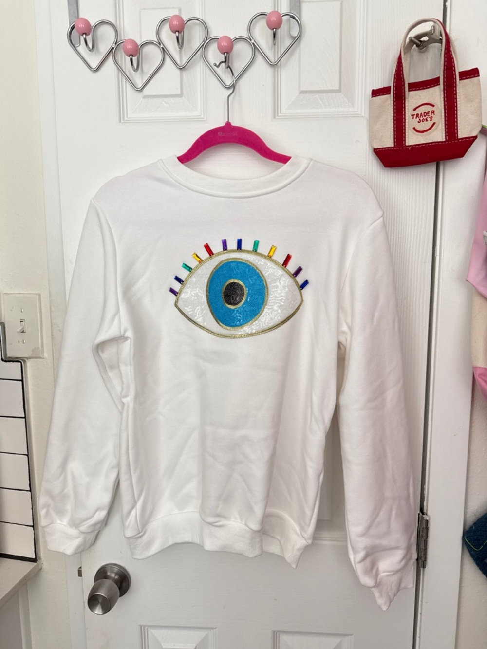Lola + The Boys White Sweatshirt with Blue Eye & Multicolor Accents